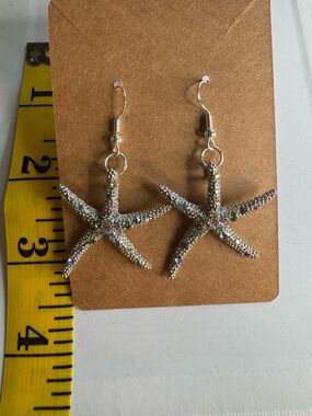 New silver tone starfish earrings